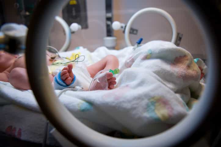 Baby boy born to woman who has been brain dead for three months Baby boy born to woman who has been brain dead for three months