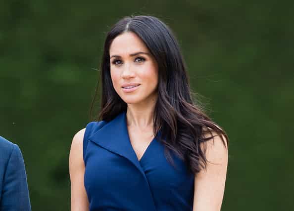 Texting on the job? Meghan was caught with her phone out on the royal tour Texting on the job? Meghan was caught with her phone out on the royal tour