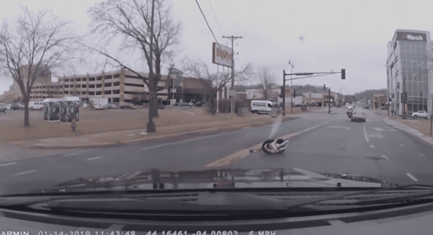 Terrifying footage shows car seat with two-year-old fall out of moving car on busy street